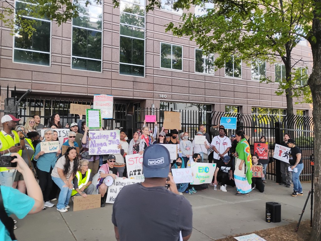 Immigrant rights activists protest ICE detentions in front of the agency's field office in Atlanta