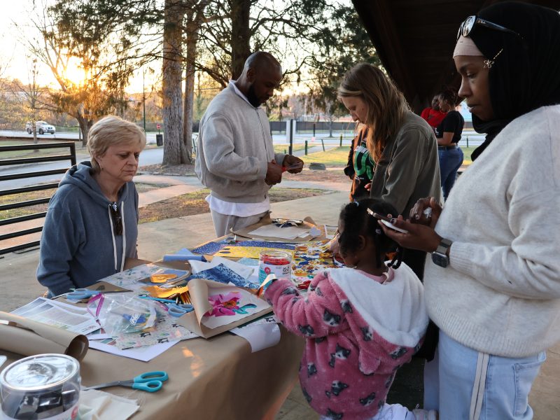 A craft table set up at the Mourning Our Losses event, allowing attendees to add adornment to their remembrances.