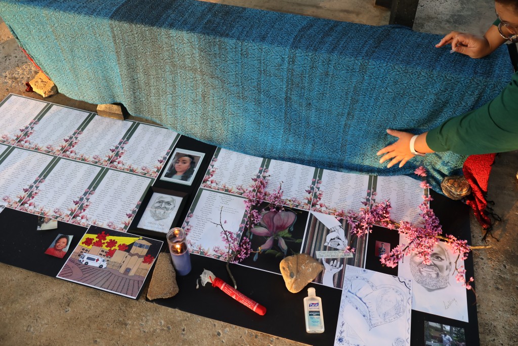 A remembrance table at the Mourning Our Losses event to memorialize those who died of COVID-19 while in Georgia prisons. 