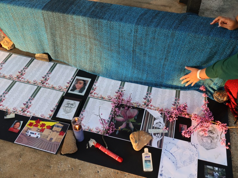 A remembrance table at the Mourning Our Losses event to memorialize those who died of COVID-19 while in Georgia prisons.