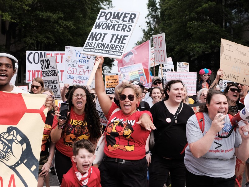 Community members march through Downtown Atlanta on May Day to protest the Trump Administration's policies impacting working-class people.