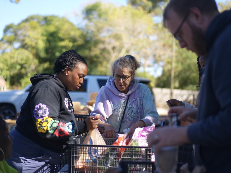 Pam Noud, founder of the Food Commune in Atlanta, Georgia, helps shoppers amid SNAP benefit cuts on Saturday, Nov. 1, 2025. (Jesse Pratt López)