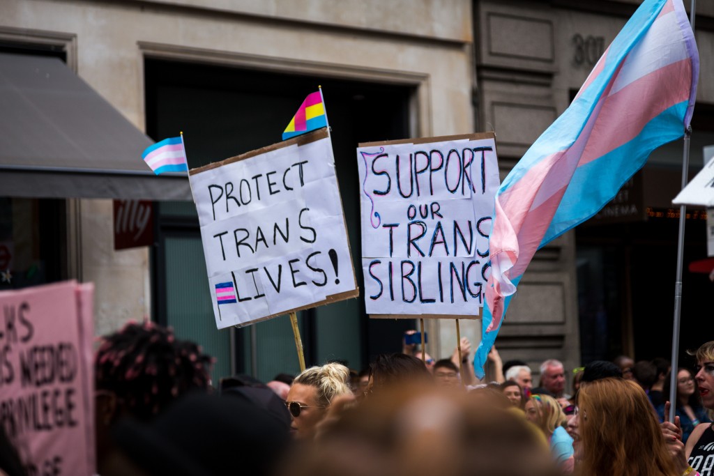 Trans health care support signs at a Pride parade in London.