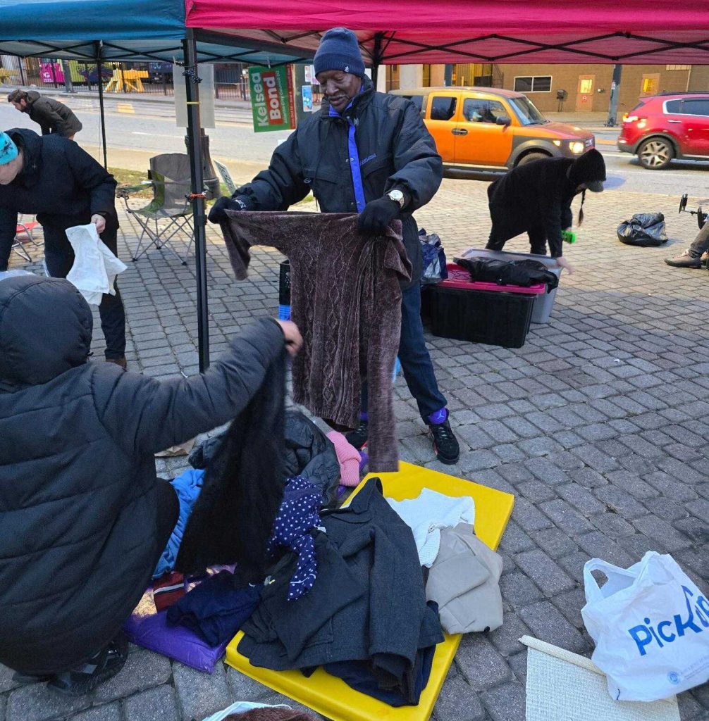 Allen Hall looks through donated clothing at “Sleep Out, Speak Out” event on Dec. 4. (Courtesy of Tim Franzen)