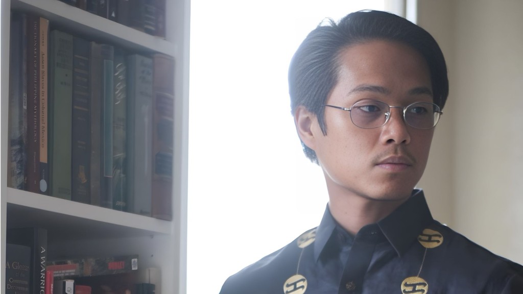 DACA recipient and photojournalist Ya'akub Vijandre, who was detained by ICE over social media posts, poses in front of library. (Courtesy of Yaa'kub Vijandre's family)