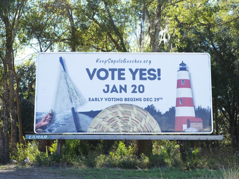 A billboard that says "VOTE YES! JAN 20" with a line below that reads "EARLY VOTING BEGINS DEC. 29TH." The billboard links to keepsapelogeechee.com
