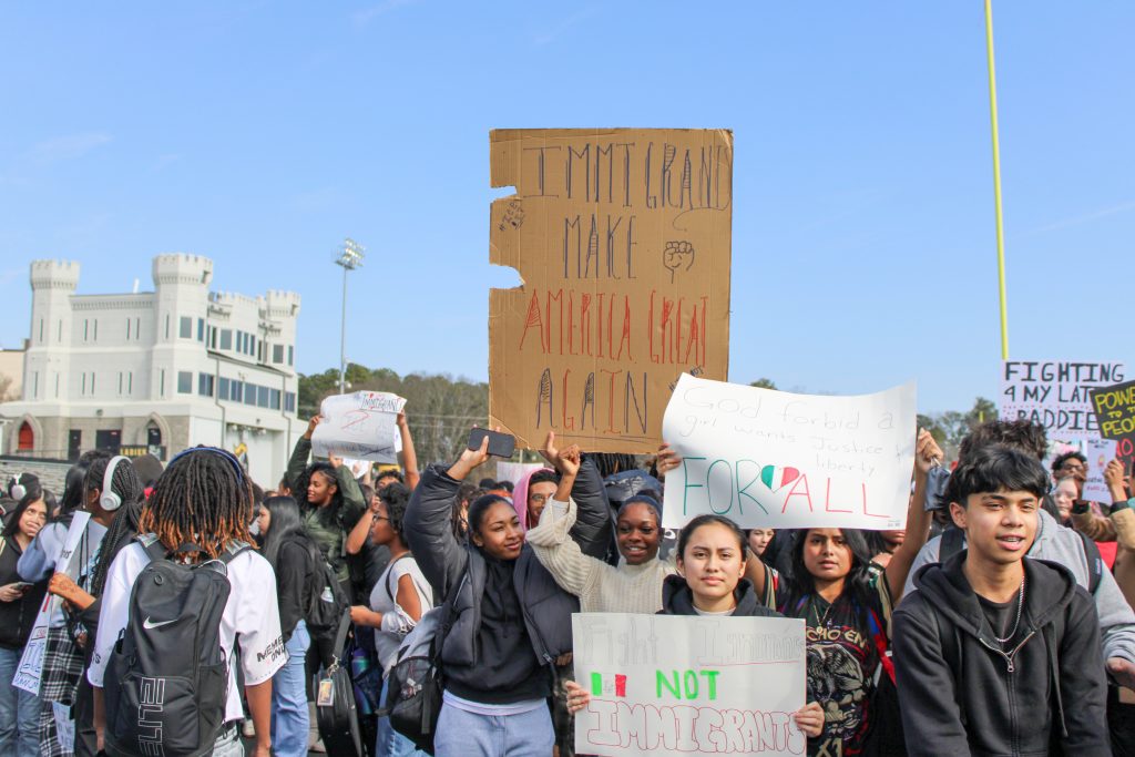 Students from Central Gwinnett High School rally outside the school building on Jan. 30, 2026, as part of a nationwide student walkout over ICE actions in Minneapolis and other cities across the country. (Maya Omar)