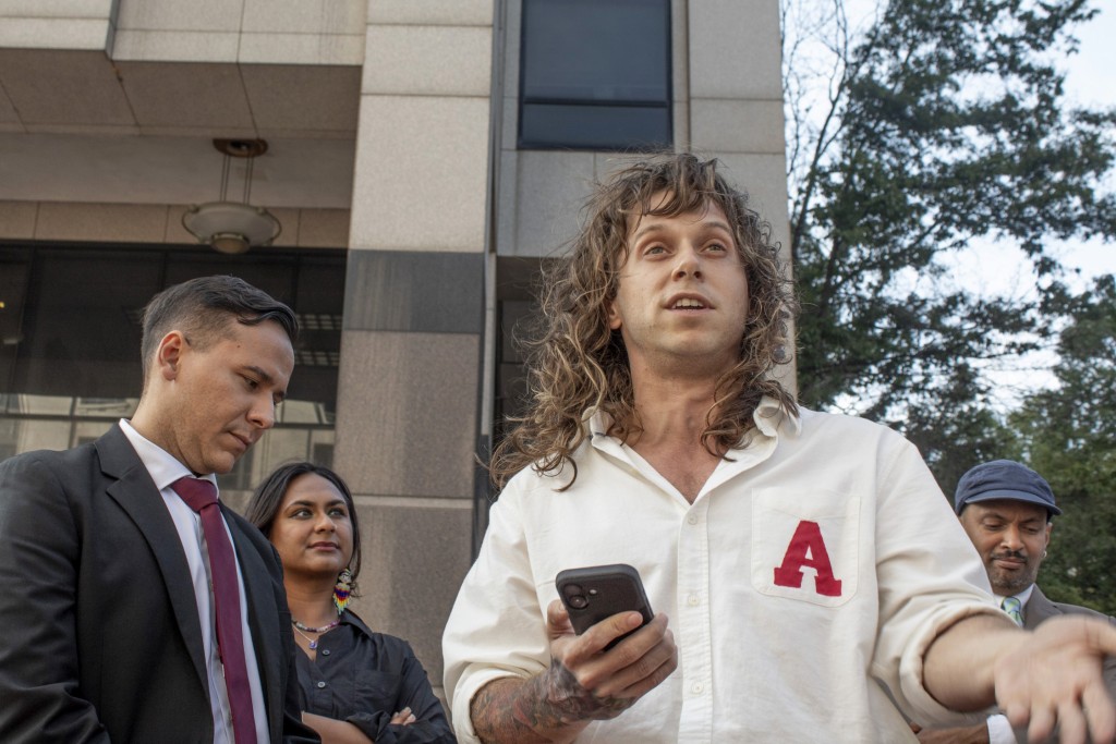 Jamie Marsicano speaks at a press conference, with her attorney Xavier T. de Janon standing behind her, outside the Fulton County Courthouse, following a motions hearing the 'Cop City' racketeering case on Sept. 8, 2025.