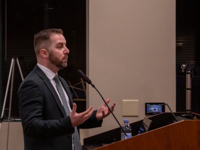 Kerry McCormack, Flock Safety's public relations manager for the East Coast, presents to the Dunwoody City Council ahead of a vote on the city's contract for Flock's 911 dispatch software on Monday, Feb. 23, 2026. (Matt Scott - Atlanta Community Press Collective)