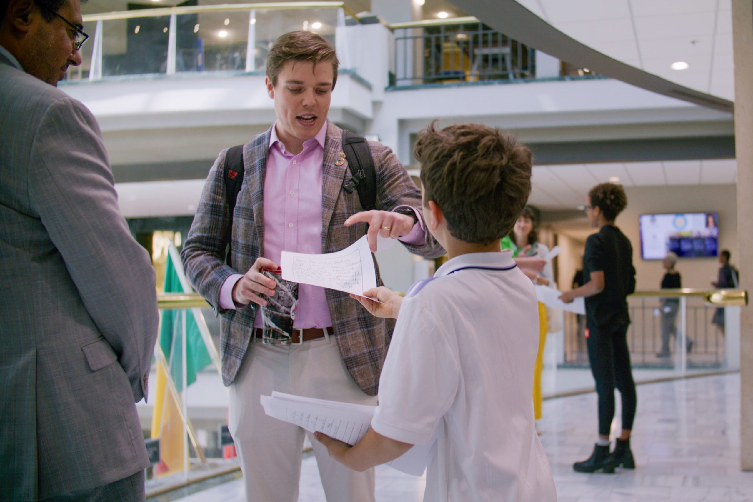 Children's movement to stop cop city, children pass out flyers in city hall