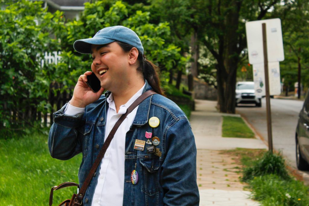 Bentley Hudgins, candidate for Georgia House District 90, talks to a campaign member in between canvassing stops in Candler Park, Atlanta on Monday, April 6, 2026. (Matt Scott / ACPC)