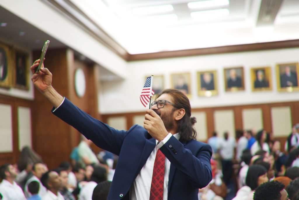 A patriotic selfie at the end of a naturalization ceremony at Richard B. Russell Federal Building on Friday, Apr. 17, 2026.